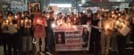 निकिता तोमर के जन्मदिन पर कैंडल मार्च निकालते लोग।