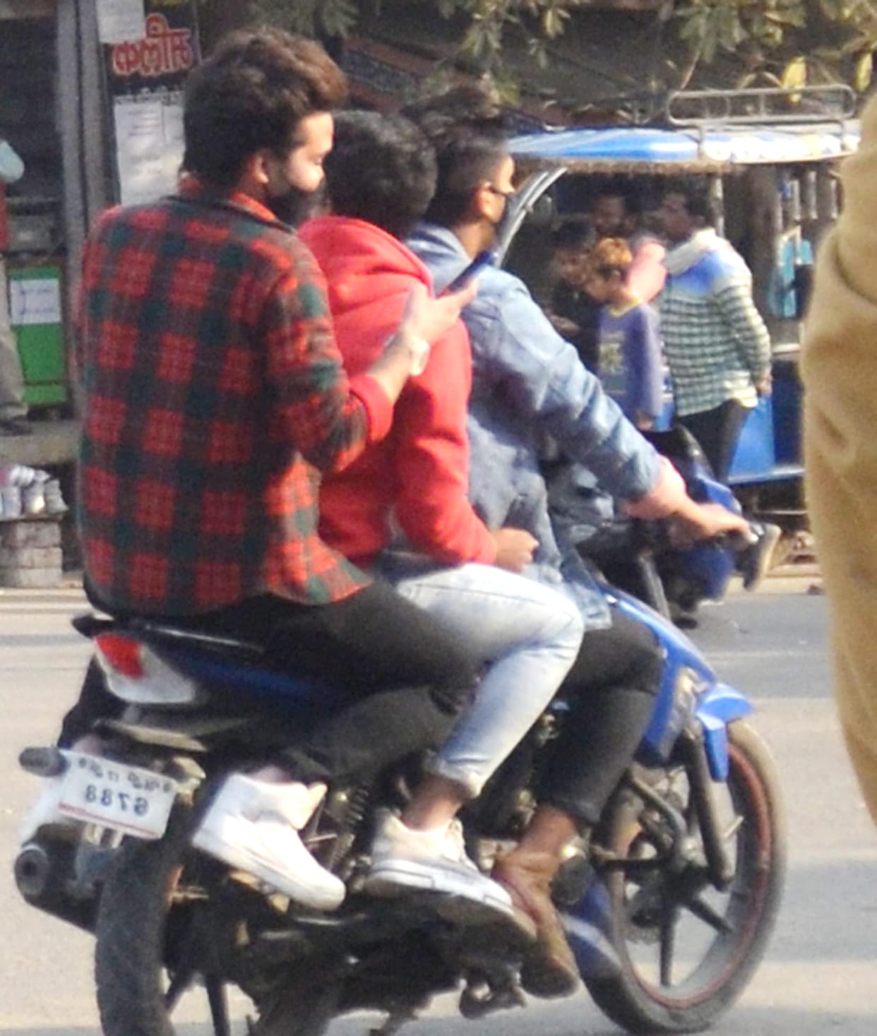 Bikers running without helmet vehicles on the highway