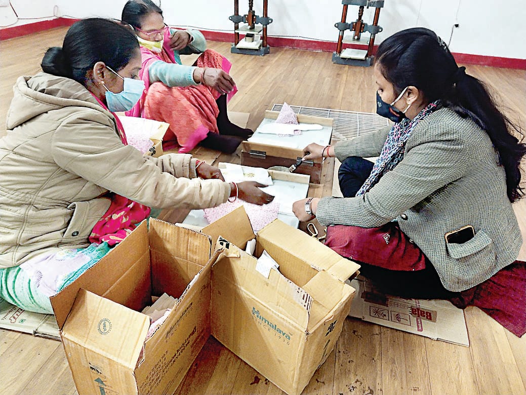 family of police personnel making  sanitary pads