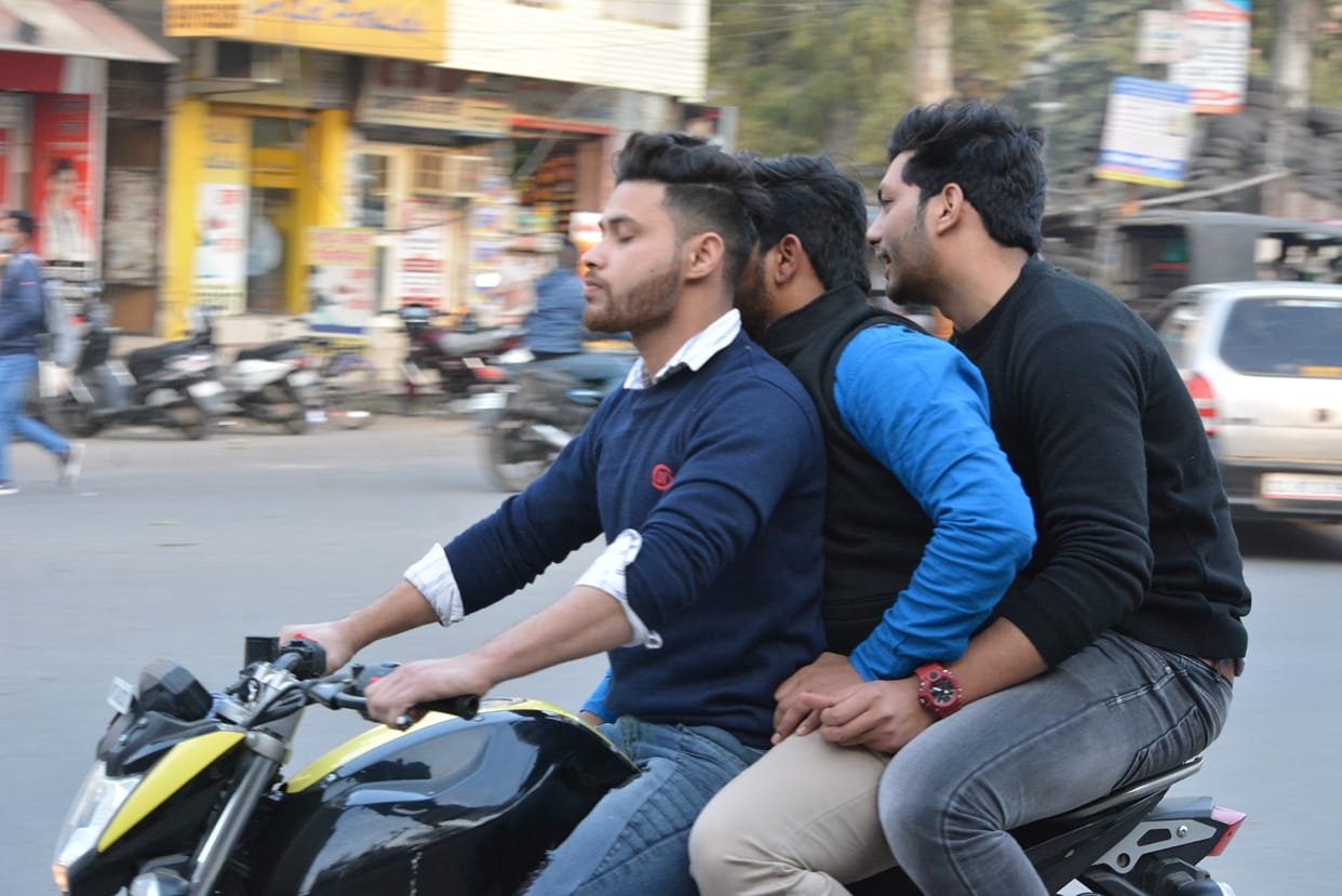 Triple riding and avoiding helmets