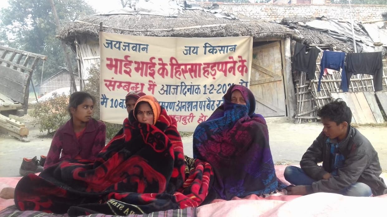 an woman with family on hunger strike