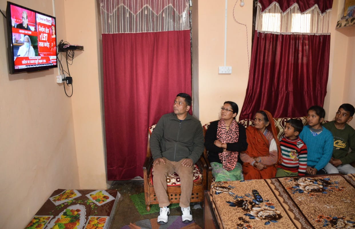 People clinging to television to watch budget  in almora