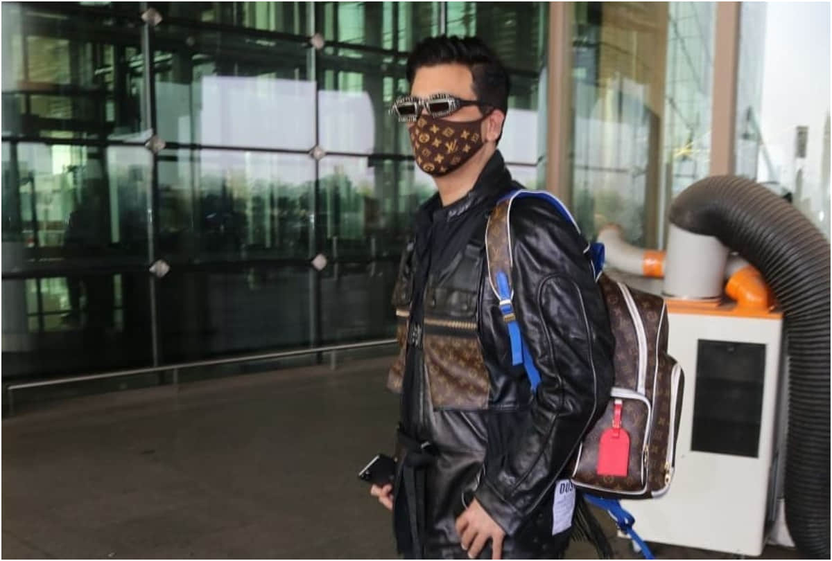 karan johar took limelight at airport with 2.7 lakh louis vuitton backpack
