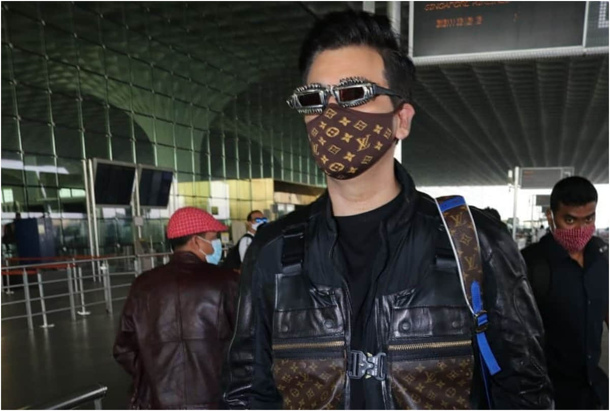 karan johar took limelight at airport with 2.7 lakh louis vuitton backpack