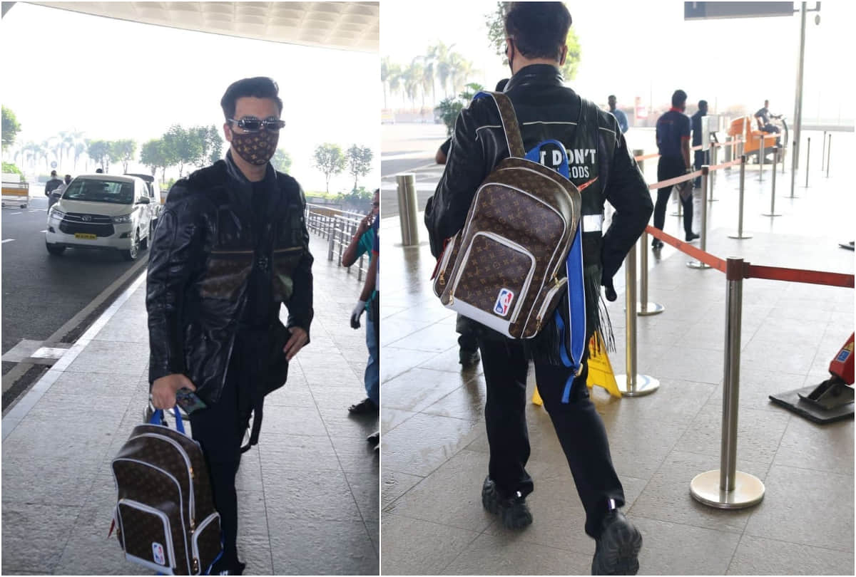 karan johar took limelight at airport with 2.7 lakh louis vuitton backpack