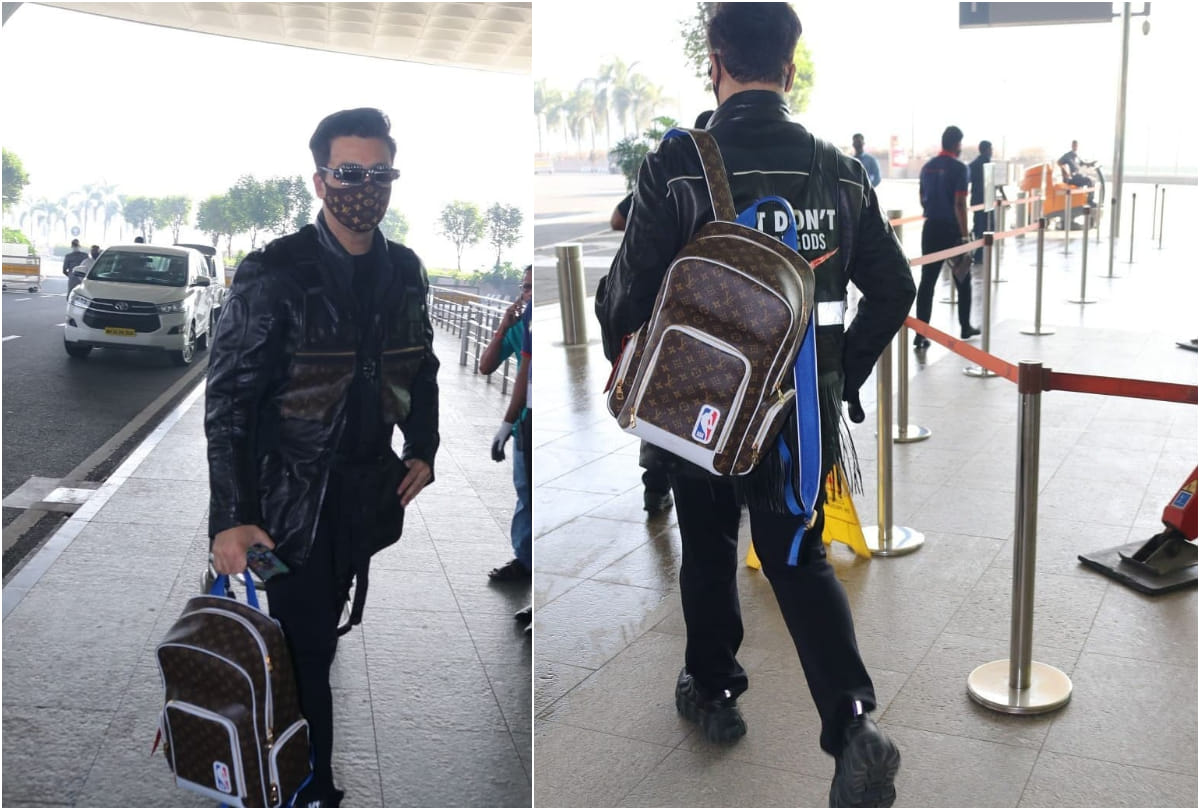 karan johar took limelight at airport with 2.7 lakh louis vuitton backpack