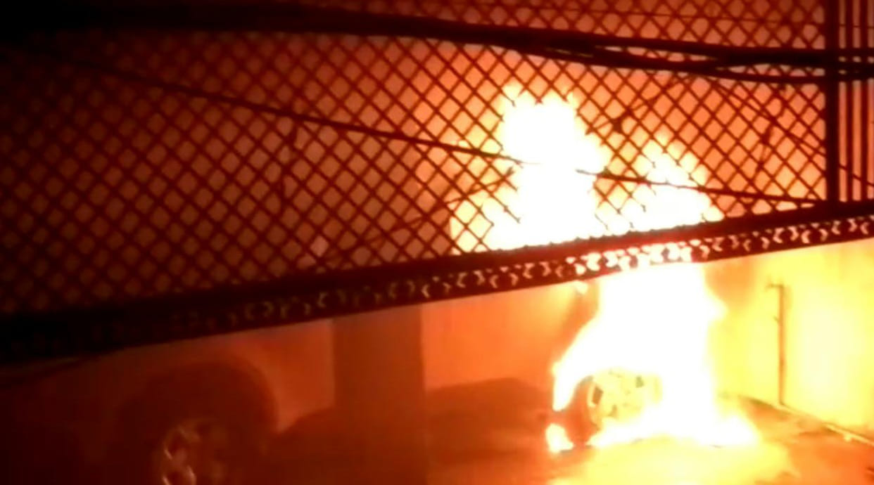 Fire in car parked in warehouse