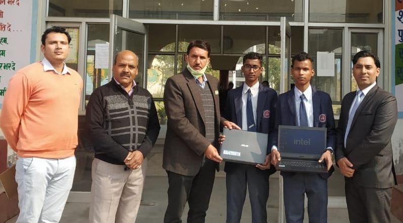two brother winning a laptop for giving innovative ideas