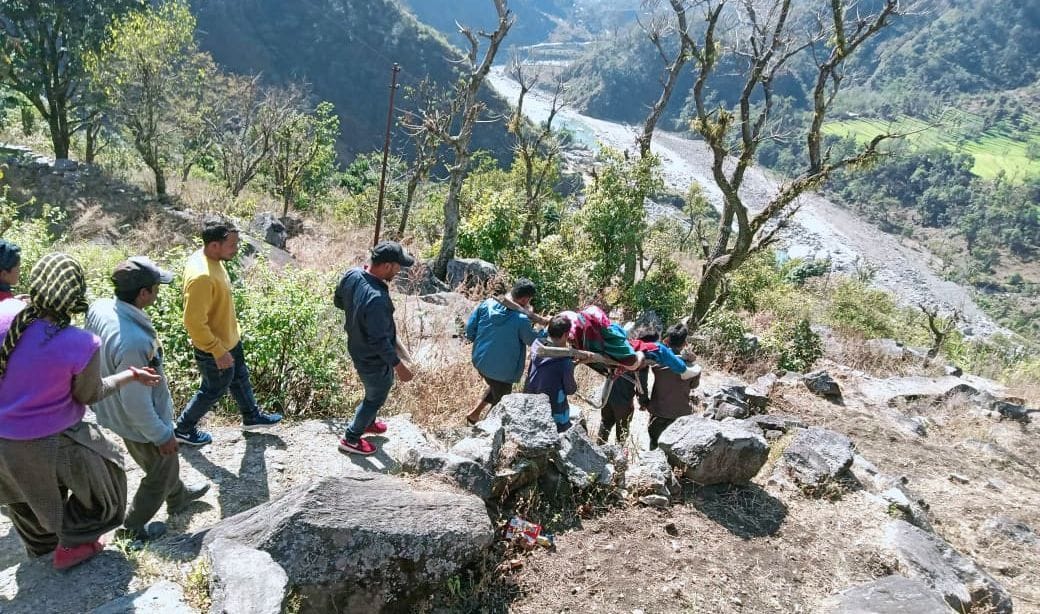 Villagers brought injured woman from Doli to road after walking for four hours