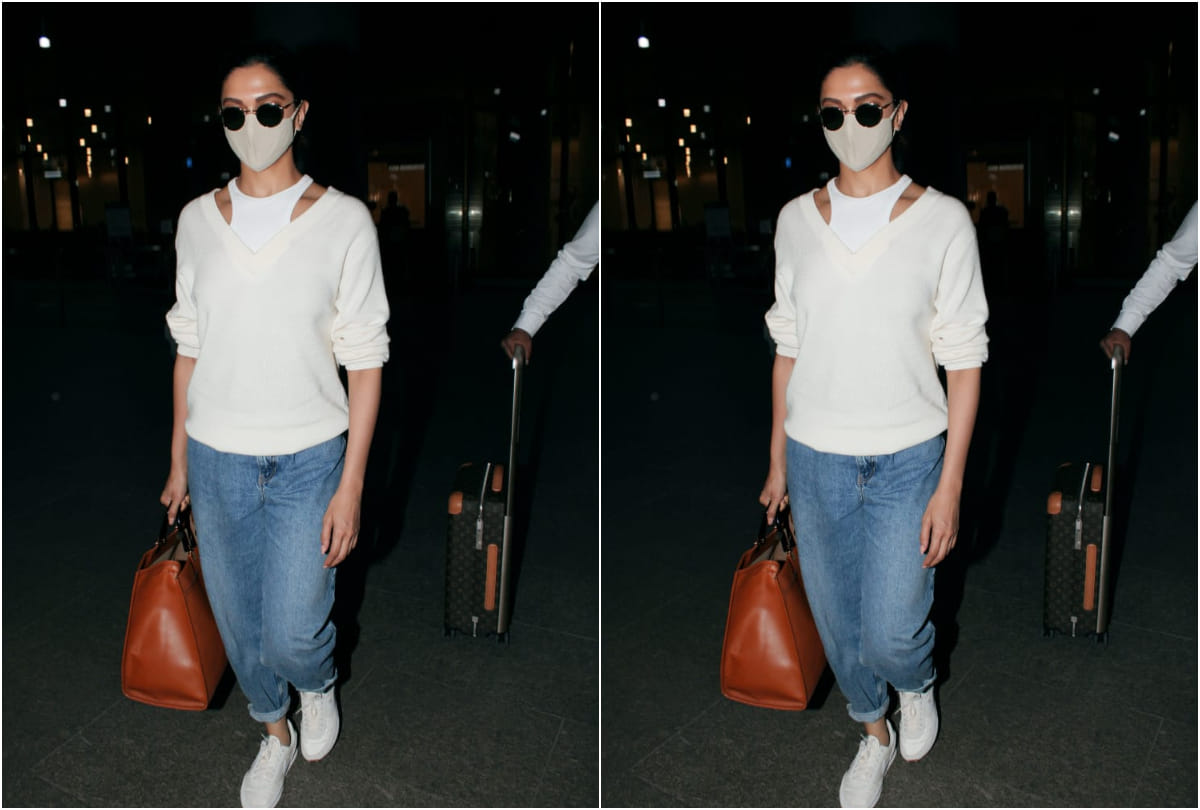 Deepika Padukone does layering right in a sweater & halter neck top at the airport