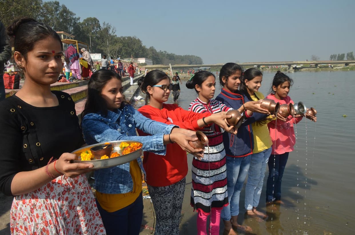 Devotees take a dip in the Ganges on Maghi Amavasya