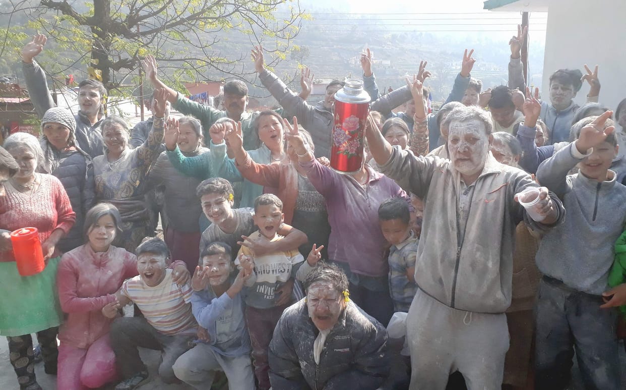 Celebration of loser by playing flour Holi