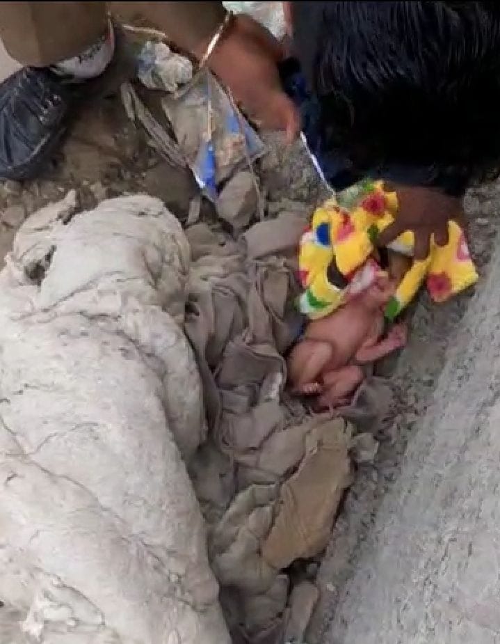 new born baby, found near severage, camera