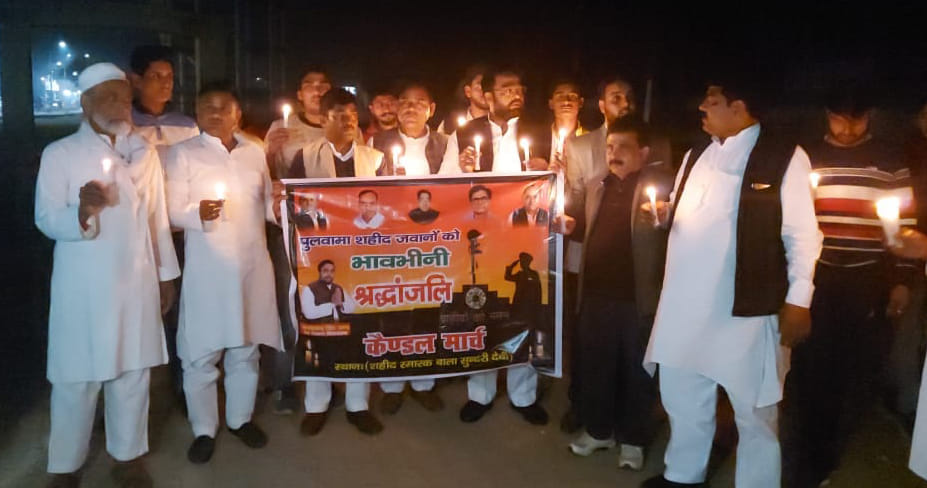 SP workers carry out candle march in memory of martyrs