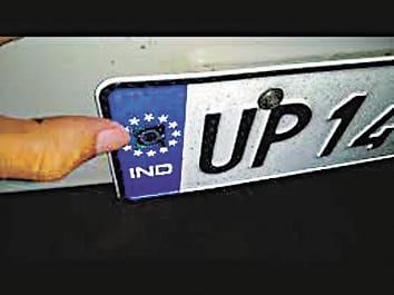 Delivery man will fitted high security number plate