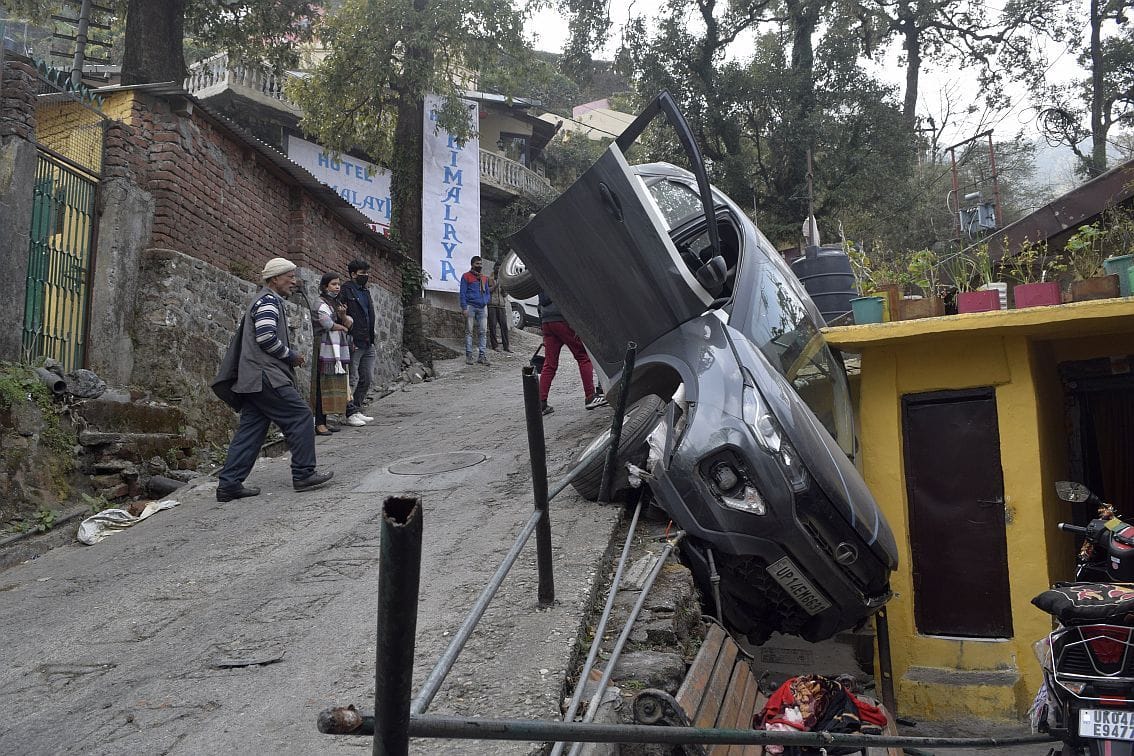 Uncontrolled car railing breaks down slope