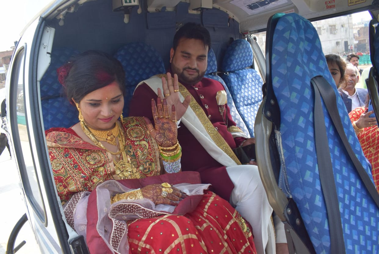 The groom arrived to send the bride away by helicopter