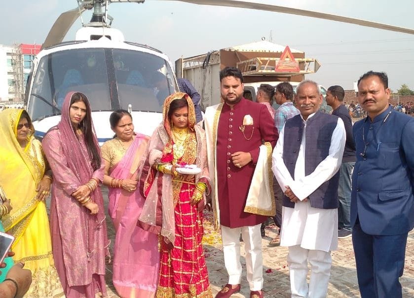 The groom brought the bride off by helicopter