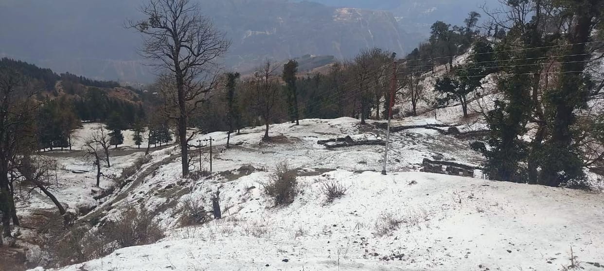 Snow in the high peaks including Eco Park of Munsiyari