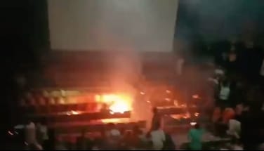Audience bursts firecrackers during the screening of Salman Khan-Shah Rukh Khan's 'Karan Arjun' in Malegaon