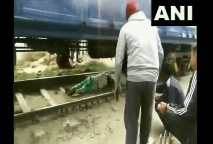 Haryana : Video of a woman trapped under train goes viral
