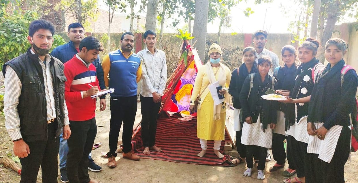Volunteers build tents in the camp
