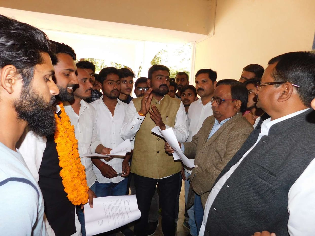 Students sit on five-point demands