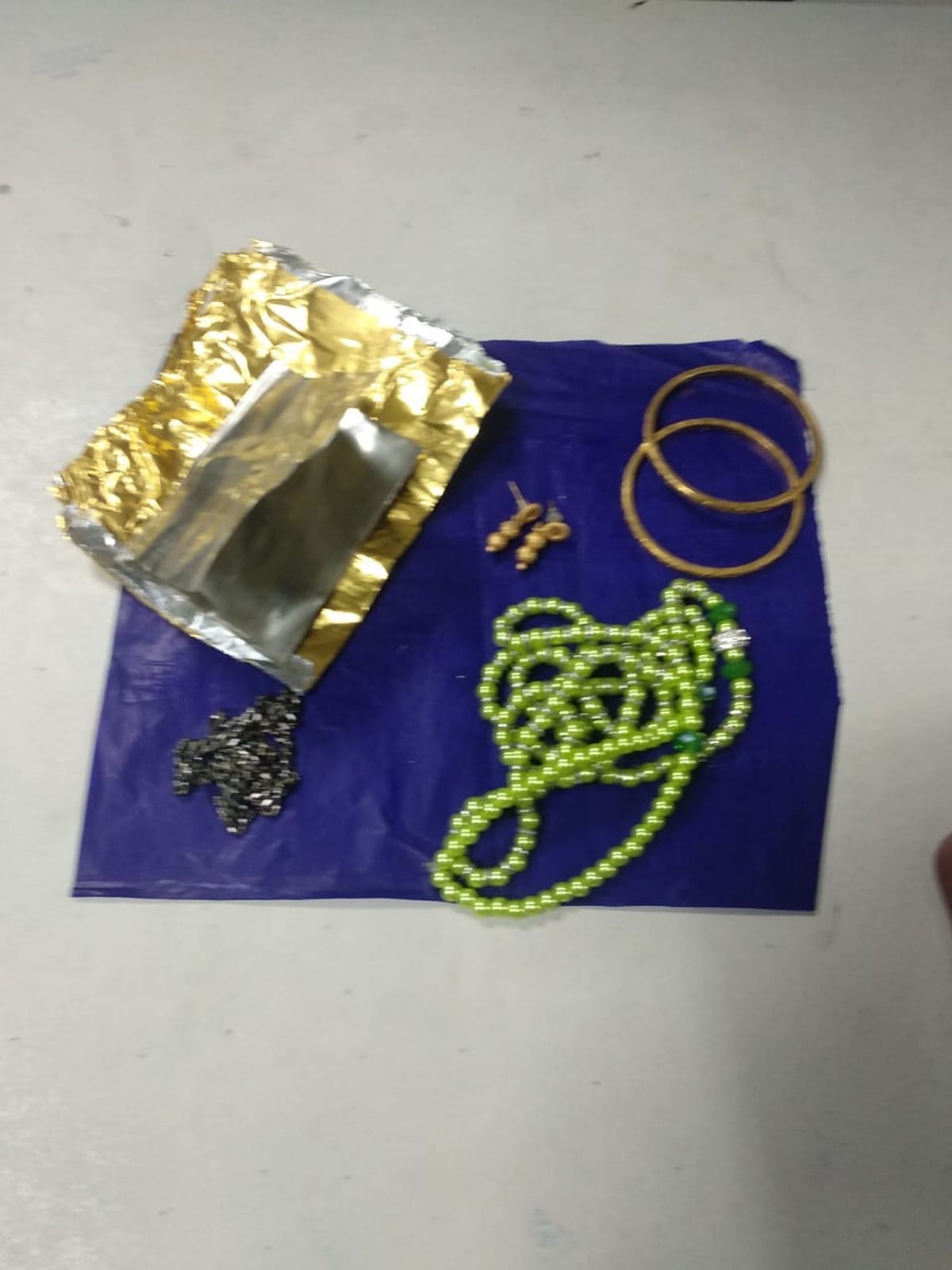 Customs team recovered 355.65 gms gold from a woman passenger at varanasi airport
