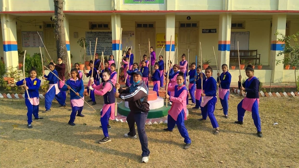 Students are learning to use self-defense sticks