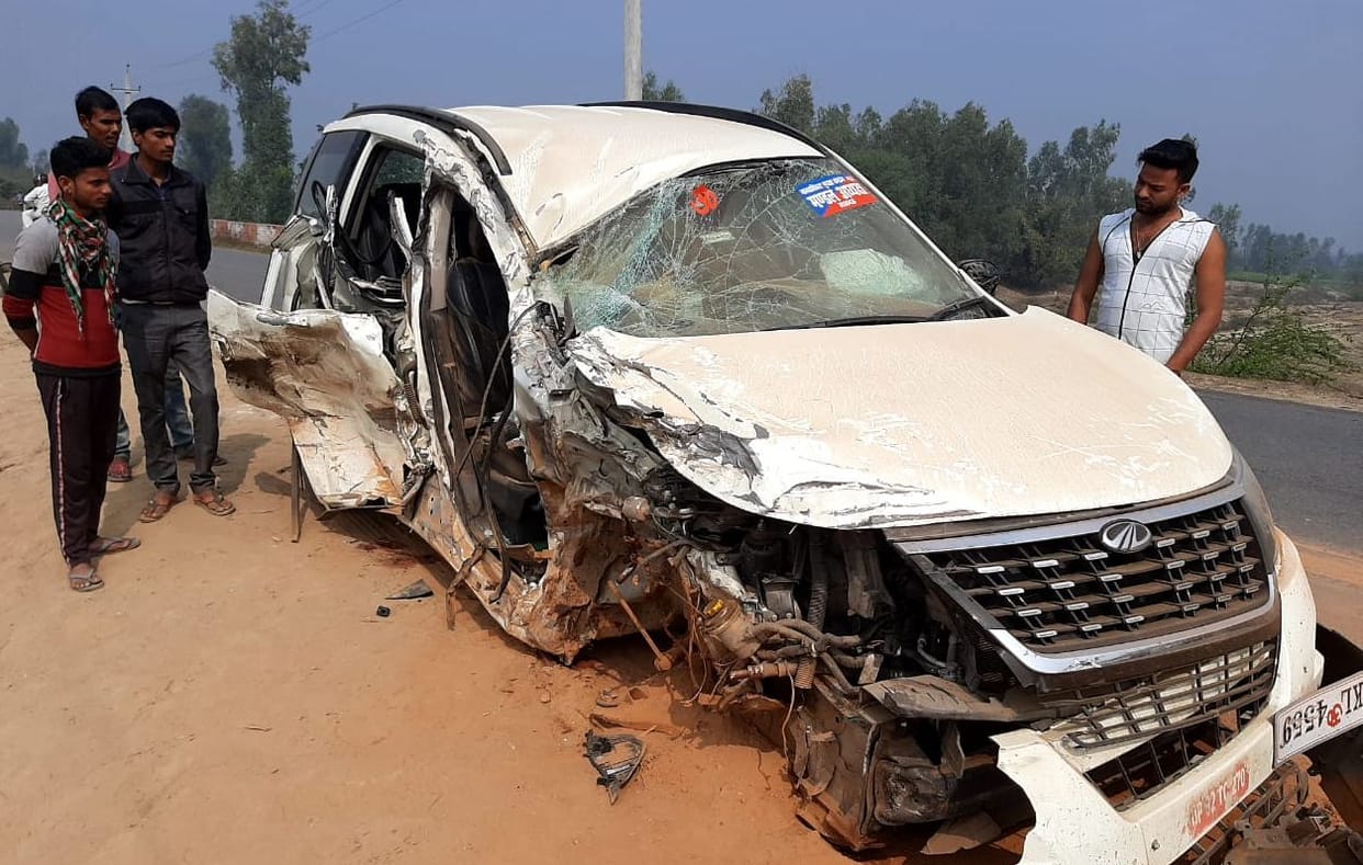 Two people dead, two injured, including head son in container-car collision