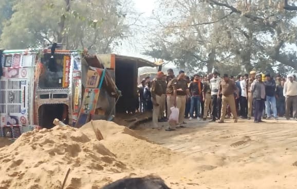 Sand loaded truck overturns on bike, two killed