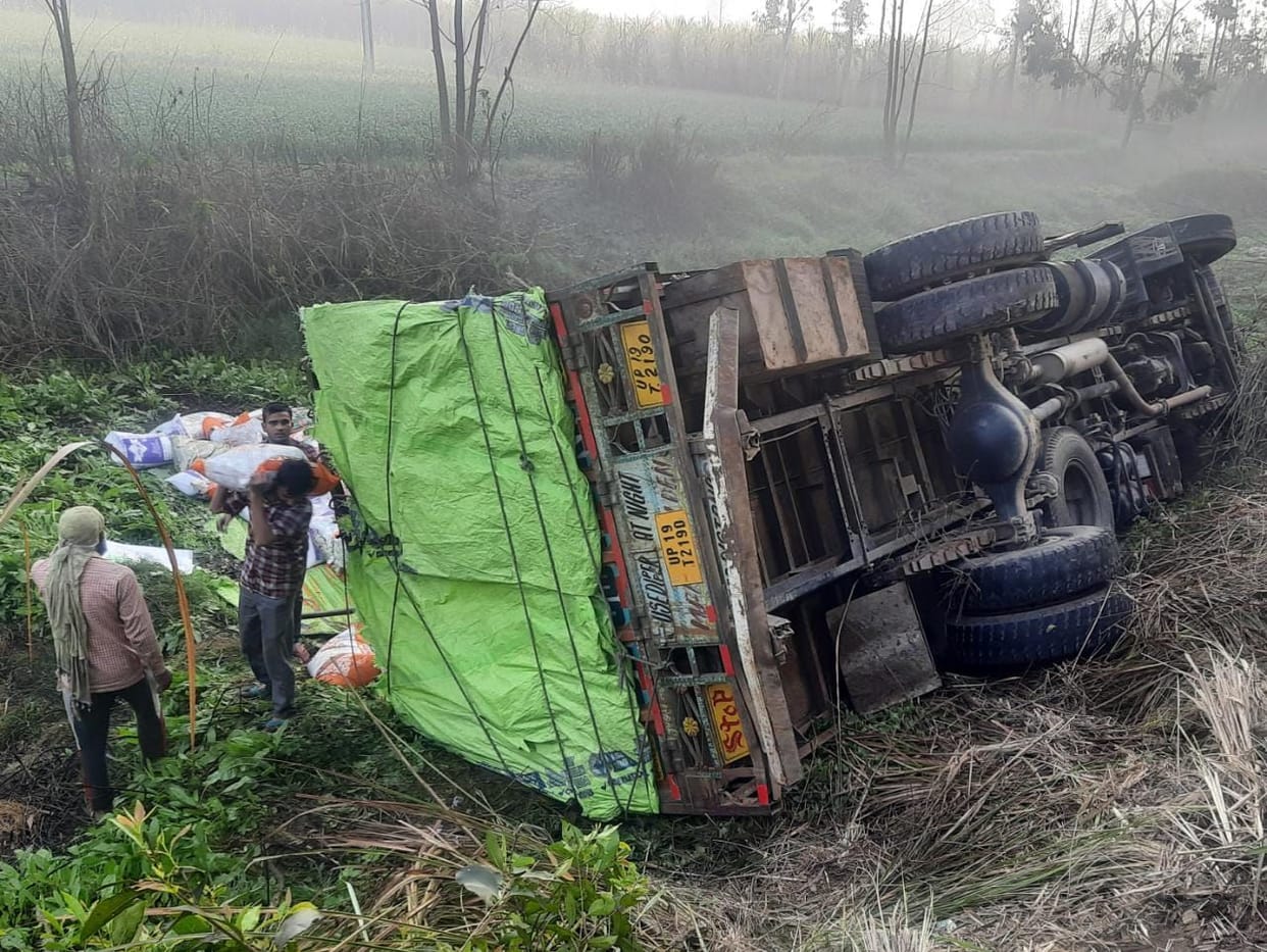 Truck overturns in trench, driver injured