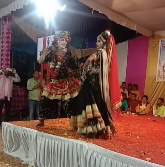 Enchanted seeing Radha-Krishna's Leela