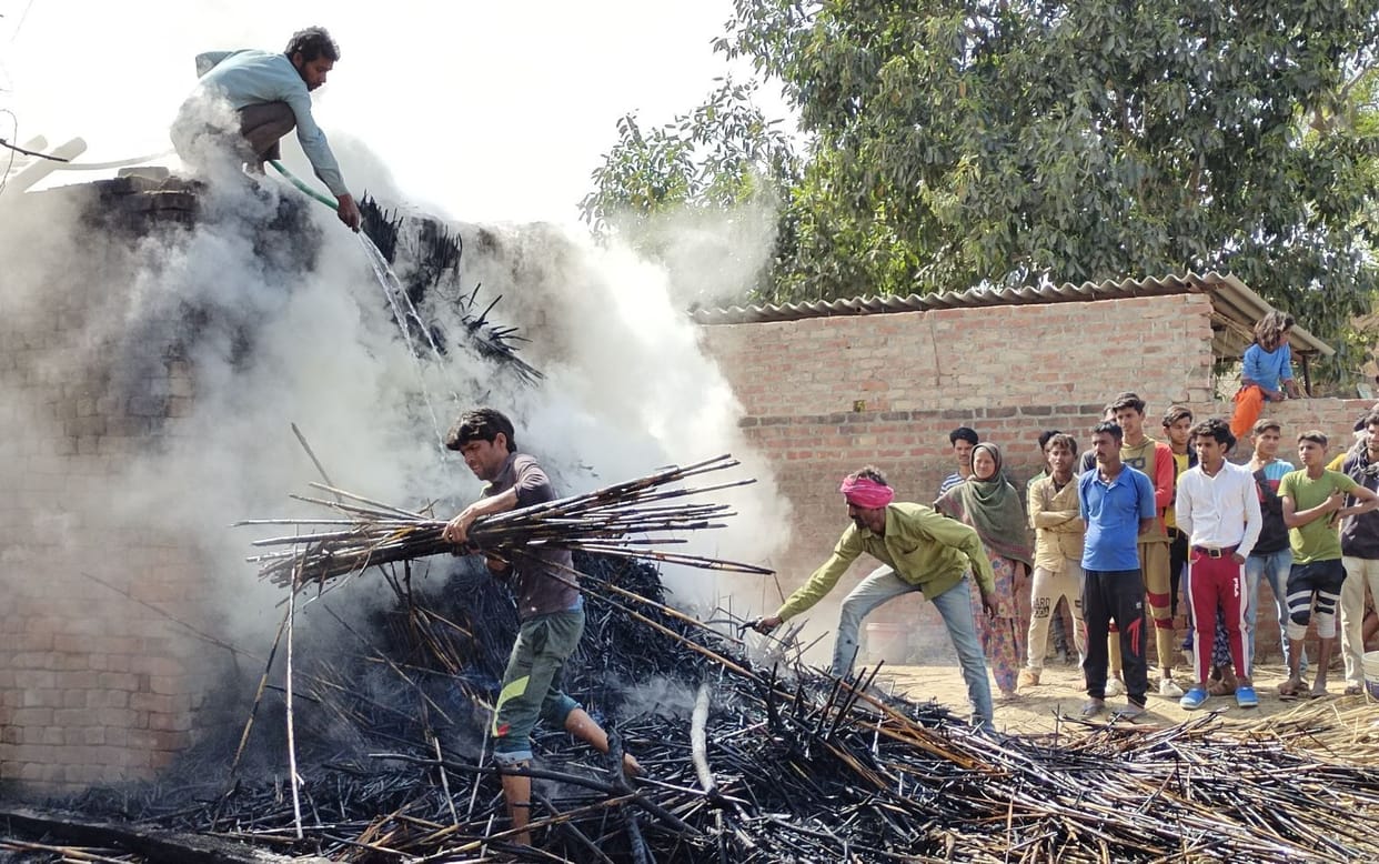Fire in three huts, ashes of householder