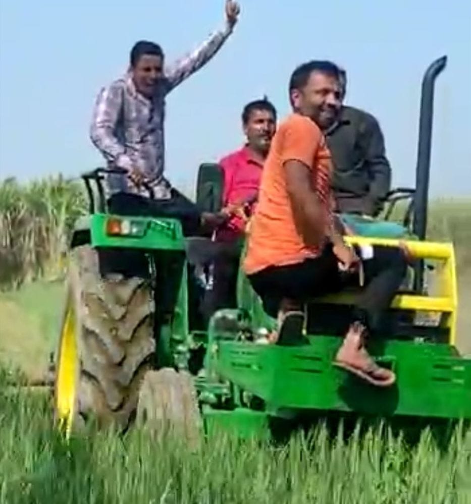 Farmer drives tractor in four bigha wheat crop