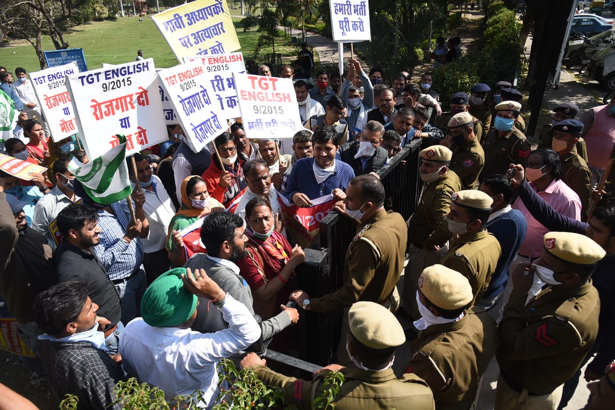Slogans protesting against cancellation of TGT English recruitment
