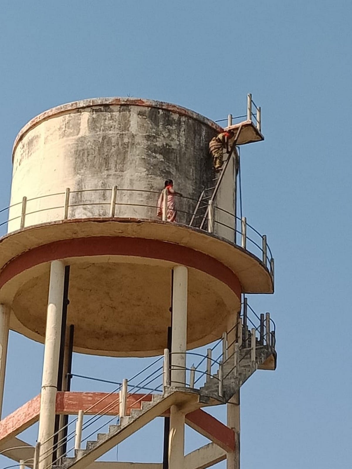 Two real sister climb on water tank for not getting possession of land in bhadohi up