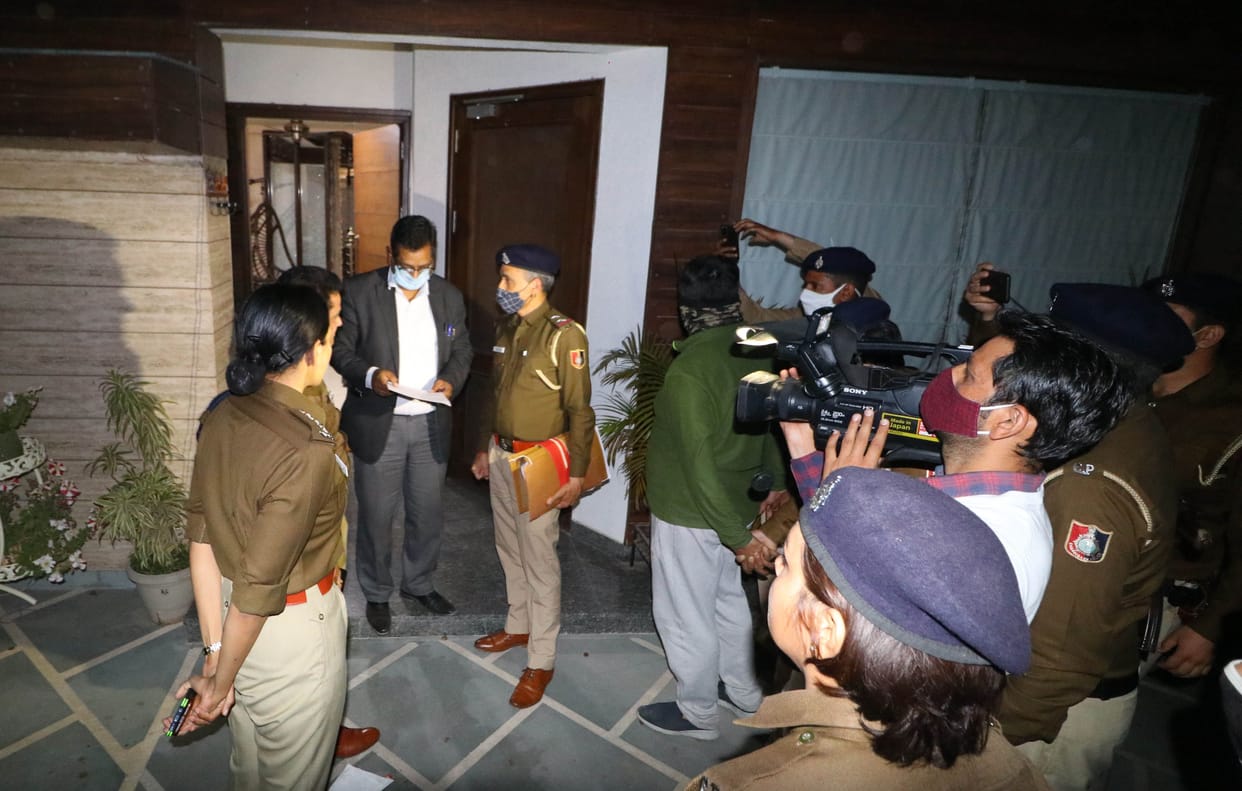 Police scrolling journalist's horoscope, raids and documents taken from home