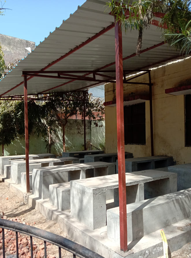 Children will eat midday meal sitting in the dining shed
