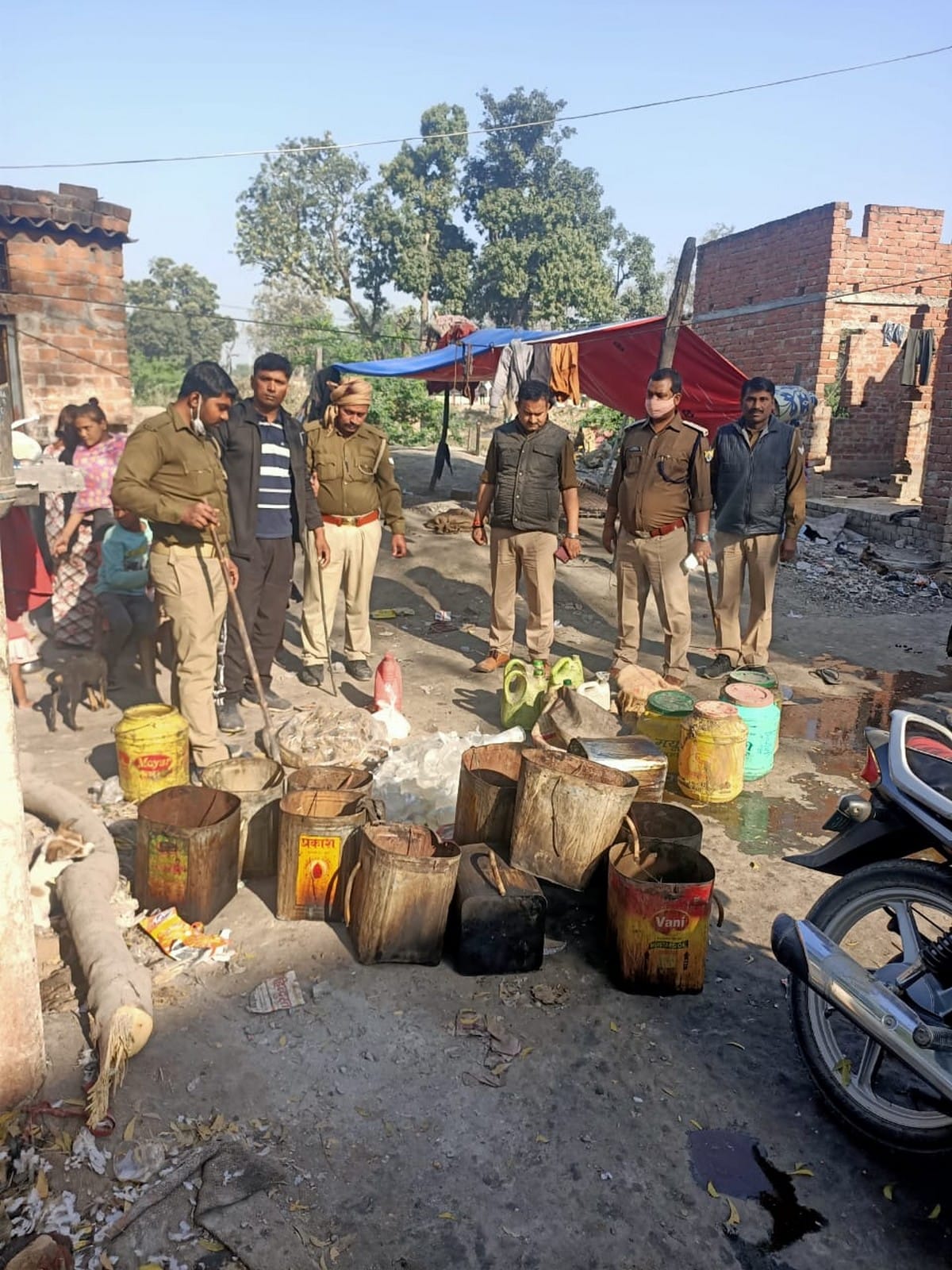 Police arrested two people with illicit liquor during excise department raid in varanasi