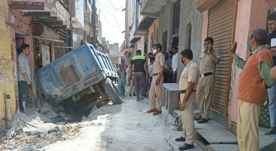 Woman dies after being trapped under a tractor-trolley