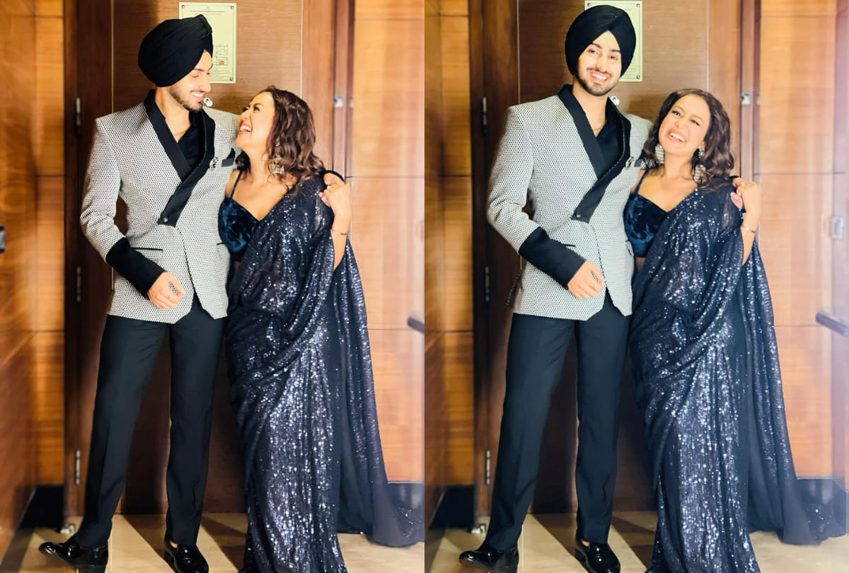 neha kakkar hotness in blue shimmer saree with velvet blouse husband rohanpreet comment on social media