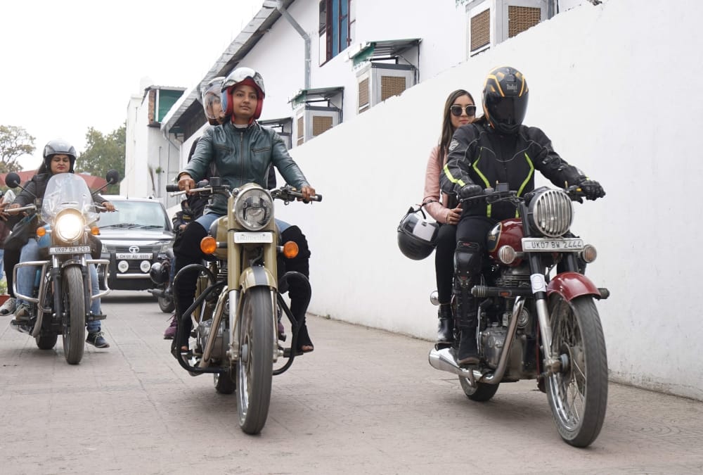 International women's day 2021: Girl Ride on Bullet in Rally in dehradun photos