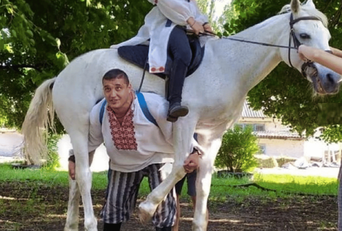 dmitriy khaladzhi man lifts horse on shoulder video goes viral