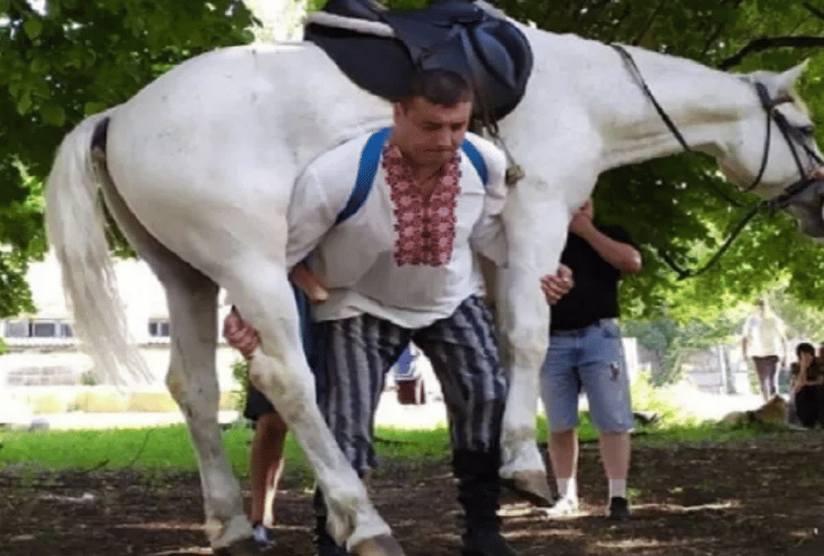 dmitriy khaladzhi man lifts horse on shoulder video goes viral
