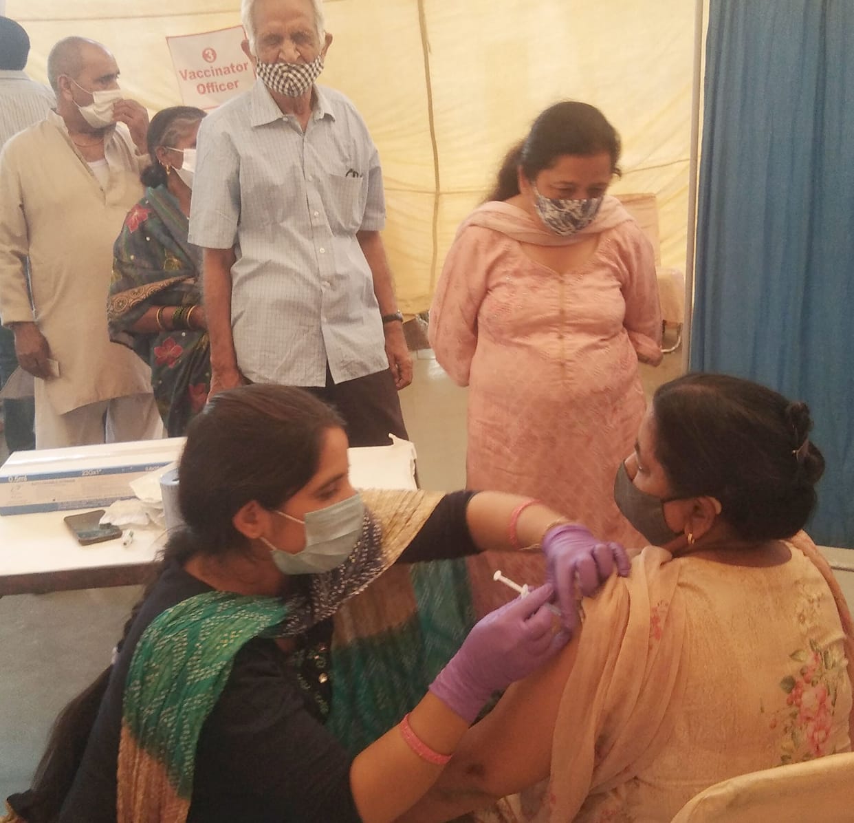 Elderly people are forced to get vaccinated in line