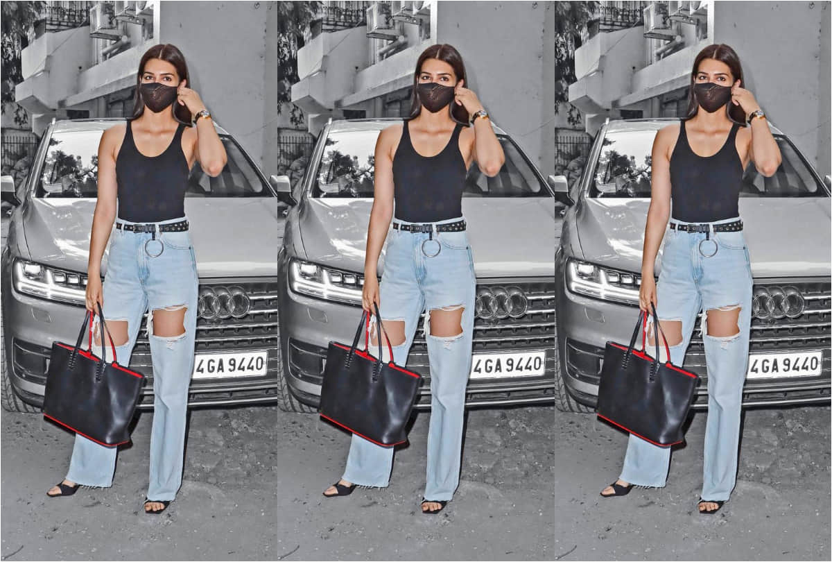 kriti sanon spotted in black backless top with blue distressed jeans in extremely hot look