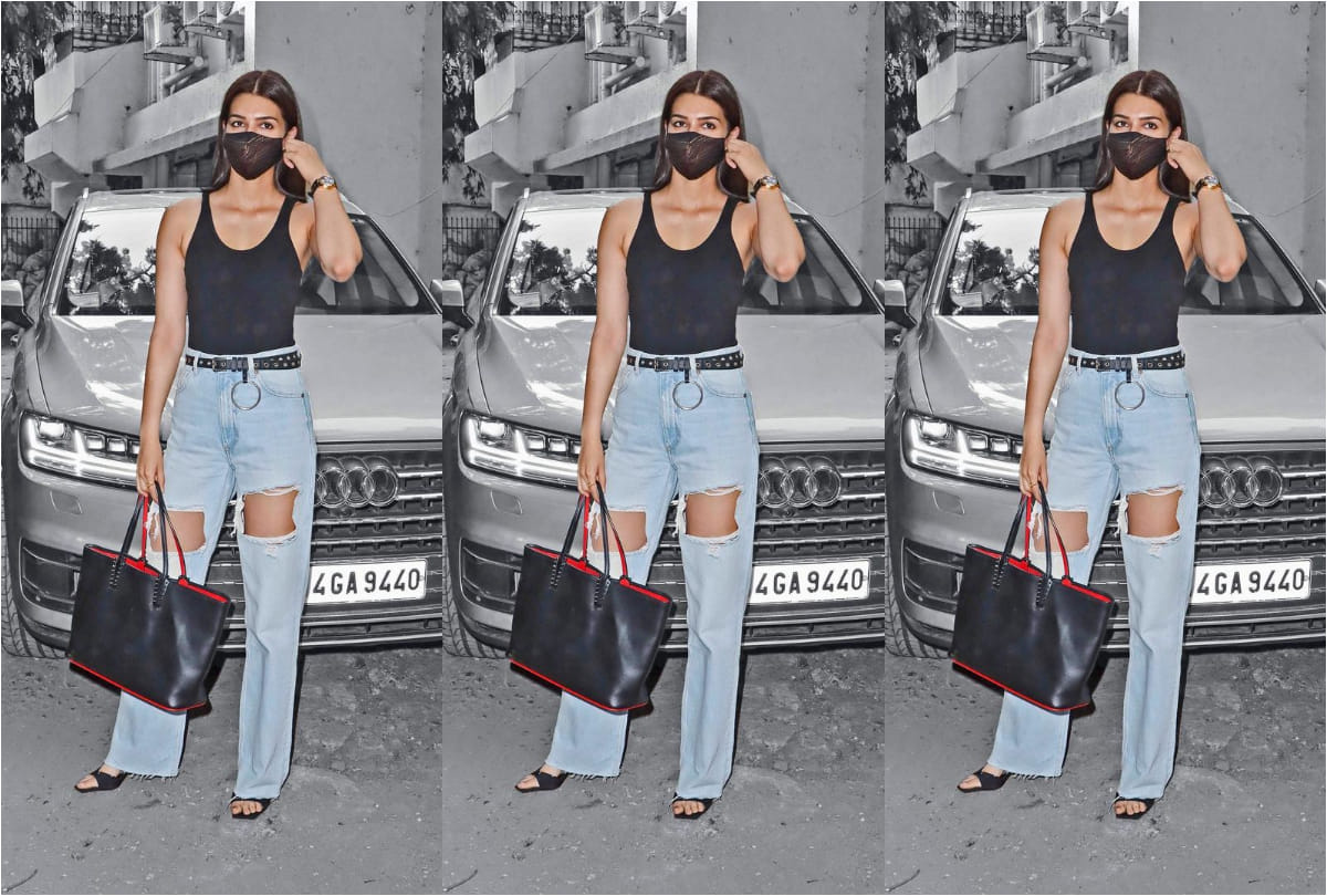 kriti sanon spotted in black backless top with blue distressed jeans in extremely hot look