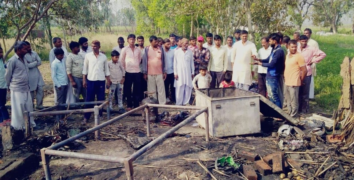 Burning goods with fire, scorching newborn's hand
