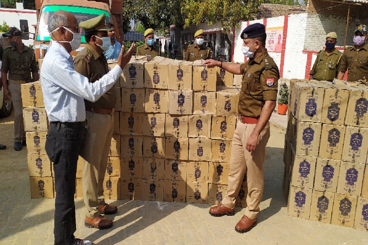 Liquor smuggling in mini truck carrying animal feed on army box three arrested in chandauli